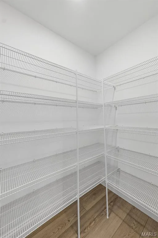 White wire shelving system, recessed ceiling light, wood-finish flooring — 8 Shady Elm Court, St Charles, MO 63301
