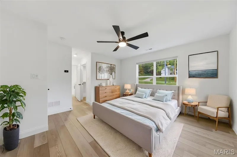 Recessed lighting, wood-finish flooring, ceiling fan with light, and a large window — 8 Shady Elm Court, St Charles, MO 63301