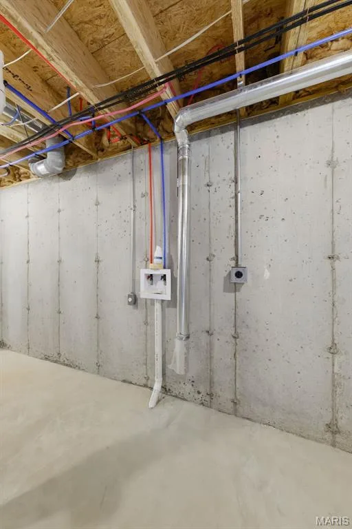 Unfinished basement featuring concrete walls, exposed ceiling joists, and a concrete floor — 8 Shady Elm Court, St Charles, MO 63301