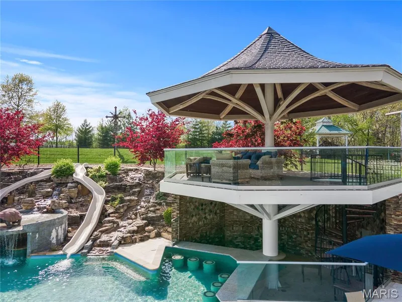 Pool has upper decking, swim up bar — 7 Hillside Court, Wentzville, MO 63385