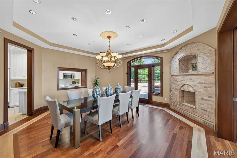 Formal dining room with a fireplace and warming box — 7 Hillside Court, Wentzville, MO 63385