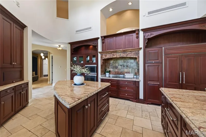 Kitchen has two islands, wall ovens, cook top with pot filler, built in fridge — 7 Hillside Court, Wentzville, MO 63385