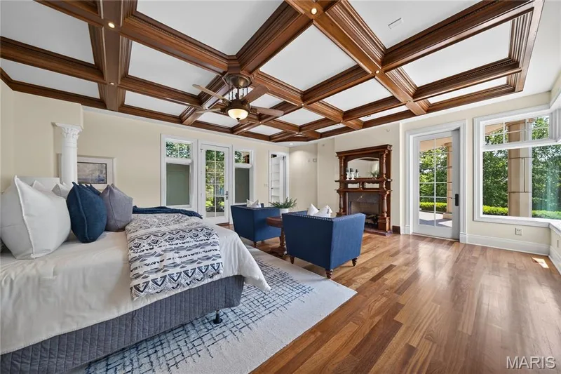 Primary suite with fireplace and hidden access to the library — 7 Hillside Court, Wentzville, MO 63385