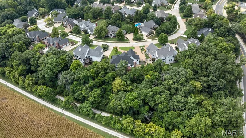 Enjoy a truly remarkable setting with a wooded backdrop and the Katy Trail just beyond, creating a rare blend of natural beauty, privacy, and outdoor recreation. — 4030 Austin Drive, St Charles, MO 63304