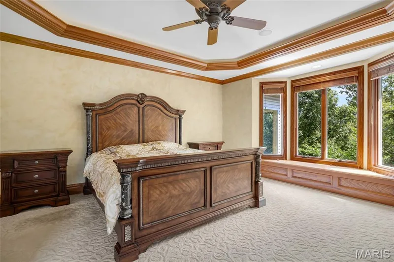 A sun-filled bay window with built-in storage, offering a peaceful retreat with timeless character. — 4030 Austin Drive, St Charles, MO 63304