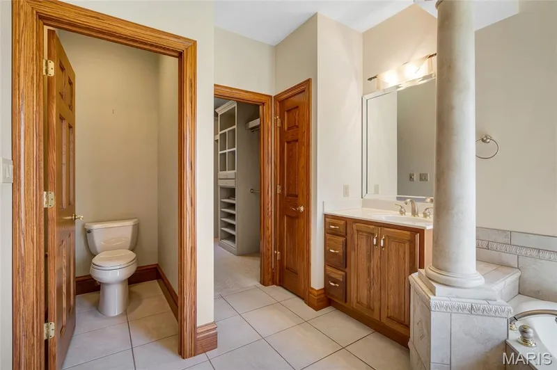 The primary bath features a private water closet and an additional linen/storage closet, offering added convenience, comfort, and privacy. — 4030 Austin Drive, St Charles, MO 63304