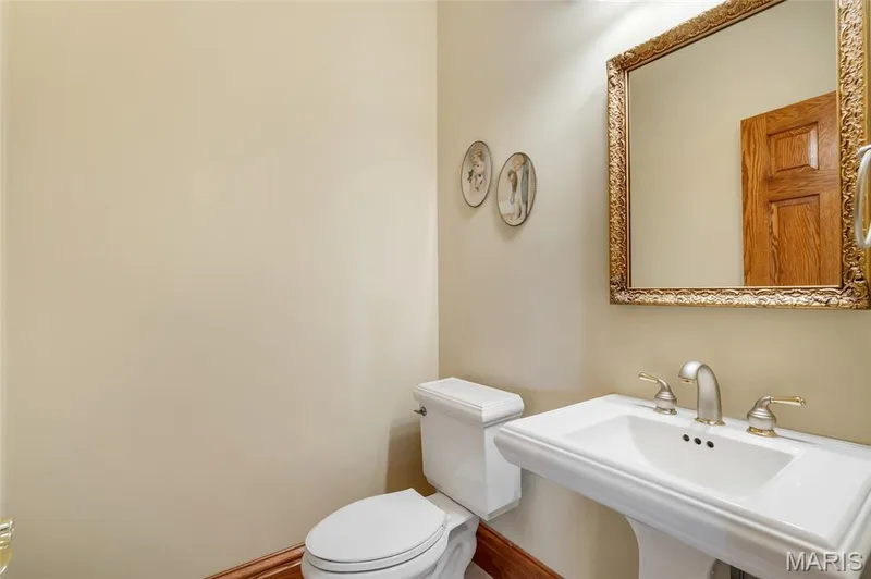Half bath conveniently located off the kitchen and garage entry. — 4030 Austin Drive, St Charles, MO 63304
