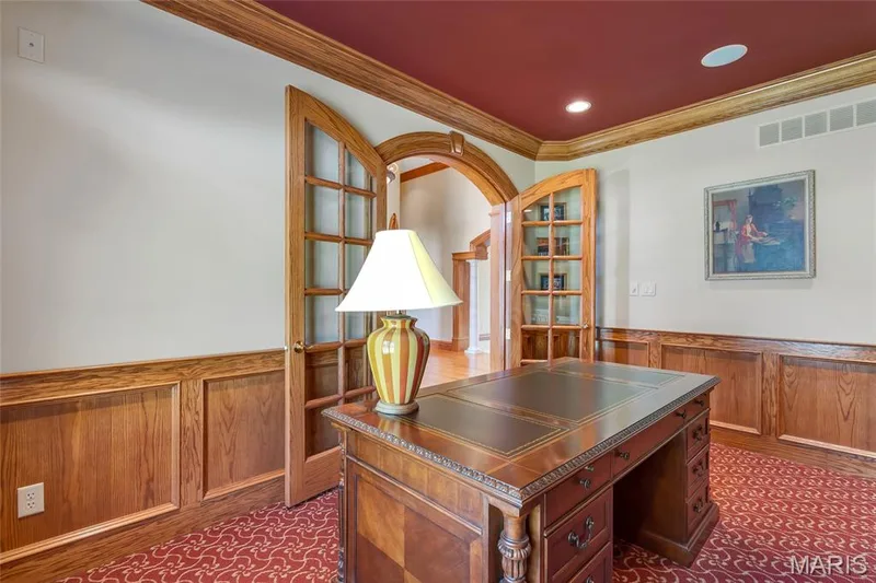 Stunning arched glass French doors make a striking first impression and provide an elegant grand entrance. — 4030 Austin Drive, St Charles, MO 63304