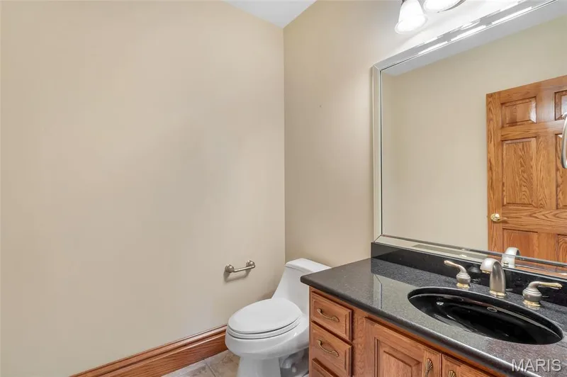 Complementing the impressive lower-level living area, the half bath offers added functionality and convenience. — 4030 Austin Drive, St Charles, MO 63304