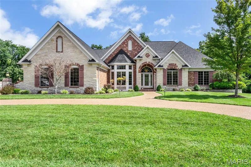 Beautiful architectural design paired with lush landscaping creates a stunning first impression and a warm welcome that instantly feels like home. — 4030 Austin Drive, St Charles, MO 63304