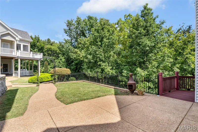 Seamlessly blending indoor and outdoor living, the recreation room opens to a generous patio with additional green space, providing endless opportunities. — 4030 Austin Drive, St Charles, MO 63304