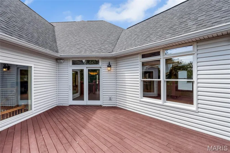 Just off the kitchen, the low-maintenance composite deck extends your living space outdoors, creating an ideal setting for morning coffee, evening cocktails, and effortless entertaining. — 4030 Austin Drive, St Charles, MO 63304