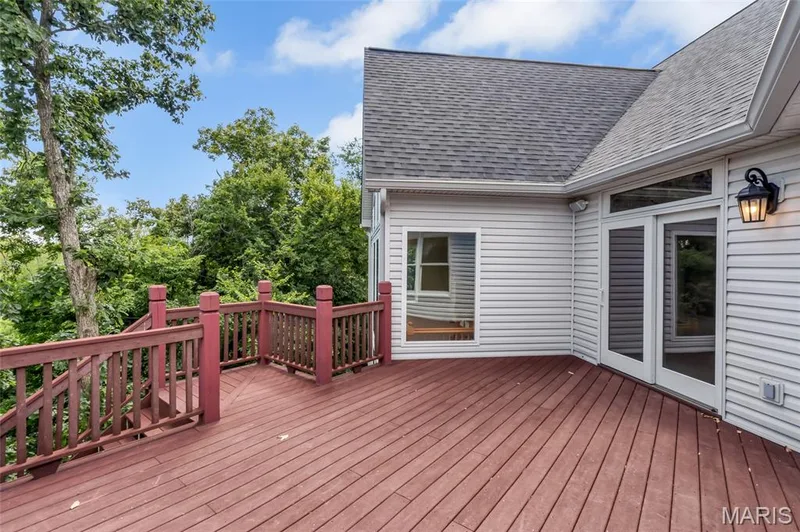 Just off the kitchen, the low-maintenance composite deck extends your living space outdoors, creating an ideal setting for morning coffee, evening cocktails, and effortless entertaining. — 4030 Austin Drive, St Charles, MO 63304