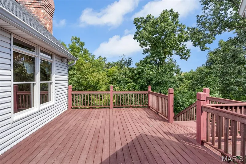 Just off the kitchen, the low-maintenance composite deck extends your living space outdoors, creating an ideal setting for morning coffee, evening cocktails, and effortless entertaining. — 4030 Austin Drive, St Charles, MO 63304