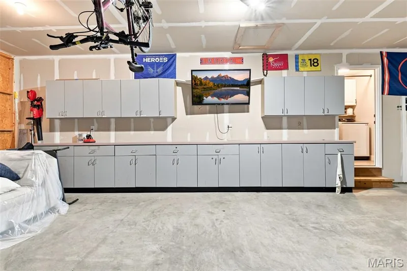 Garage storage cabinets & counters can stay — 130 Pomodora Circle, Wentzville, MO 63385