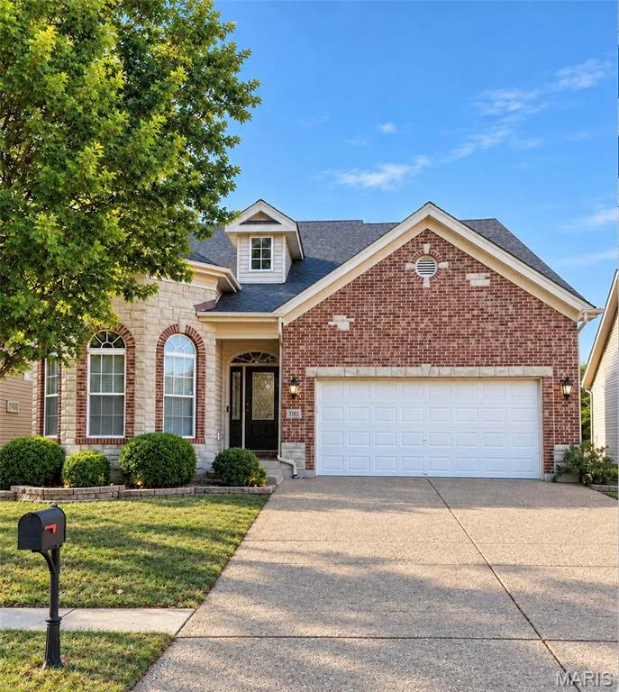 Brick and stone facade with arched window accents — 3105 Wheeling Drive, St Charles, MO 63301