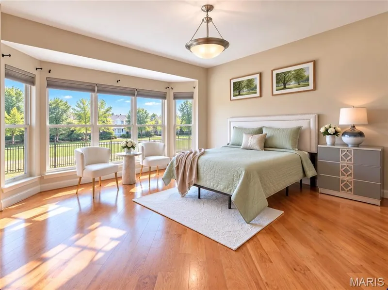Hardwood flooring, bay window with multiple panes, ceiling-mounted light fixture, light-toned walls — 3105 Wheeling Drive, St Charles, MO 63301