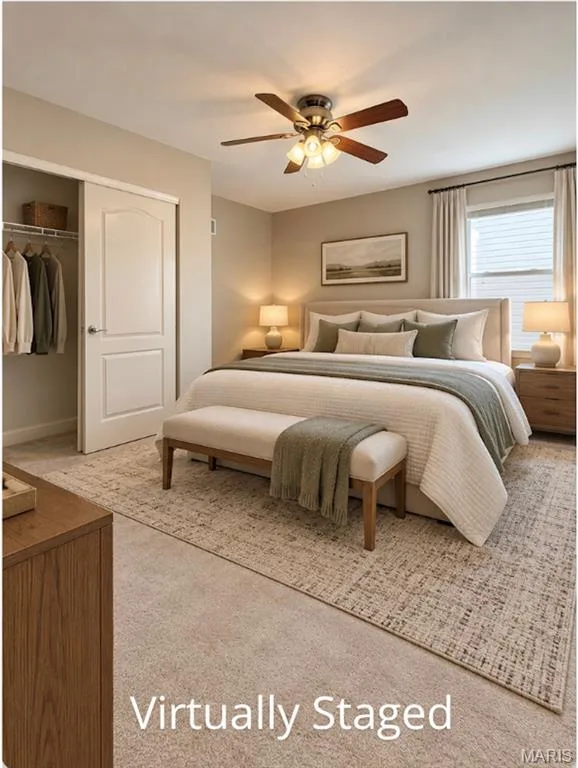 Wall-to-wall carpeting, window with blinds, ceiling fan with integrated lighting, and a bi-fold closet door — 3105 Wheeling Drive, St Charles, MO 63301