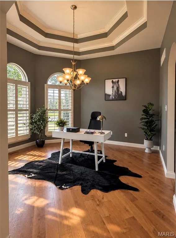 Great room for Office or Dining room with  Tray ceiling with crown molding, wood-finish flooring, and arched windows featuring plantation shutters — 3105 Wheeling Drive, St Charles, MO 63301