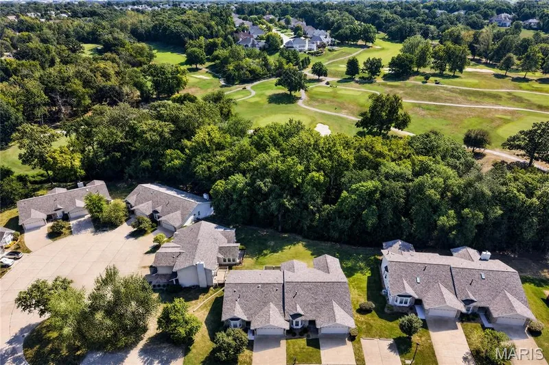 6th green sits behind tree line — 912 Palmer Court #12, Lake St. Louis, MO 63367