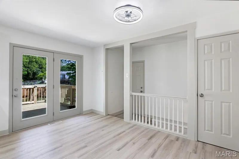 Access to the new deck, access to the garage and stairwell to the basement, large pantry — 3424 La Salle Drive, St Charles, MO 63301