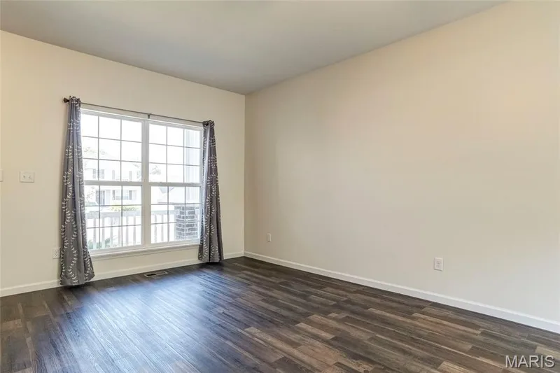 Tasteful LVP flooring throughout main level — 456 Dusty Brook Drive, O'Fallon, MO 63366