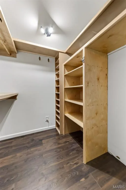 Built-in shelving, wood-finish flooring, recessed lighting, and a neutral wall color — 19 Novella Drive, St Peters, MO 63376