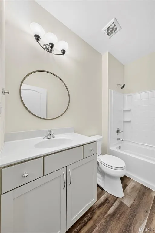 White single vanity with integrated sink, chrome faucet, and brushed nickel hardware — 622 Cruden Bay Court, Dardenne Prairie, MO 63368