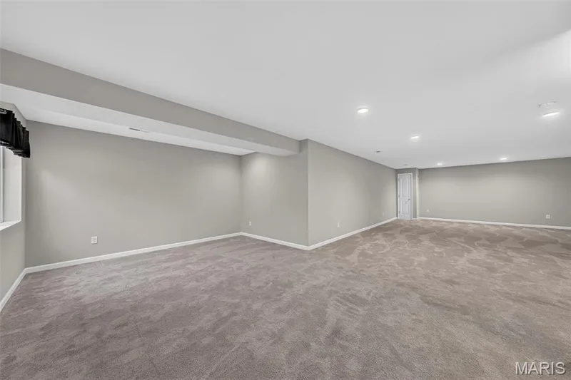 Spacious room featuring neutral carpet and recessed lighting — 622 Cruden Bay Court, Dardenne Prairie, MO 63368