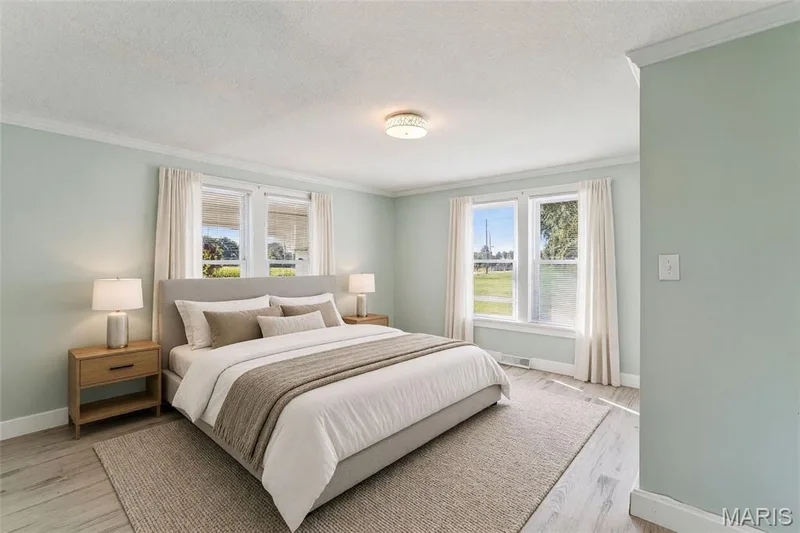 Recessed lighting, crown molding, double windows, wood-finish flooring, and soft wall tones — 435 Highway T, Foristell, MO 63348