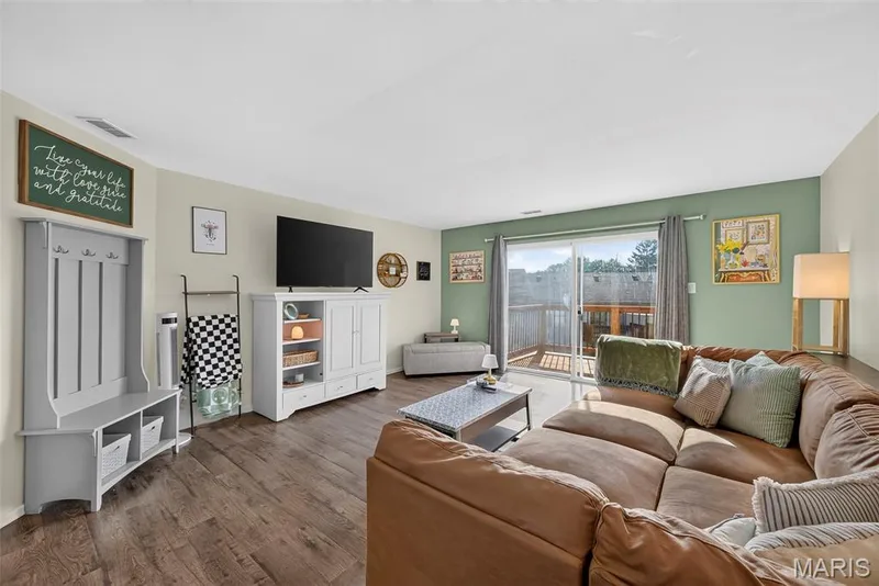 Living Room with Large Sliding Door to a New Deck (2026) — 74 Sugar Glen Court #6, St Peters, MO 63376