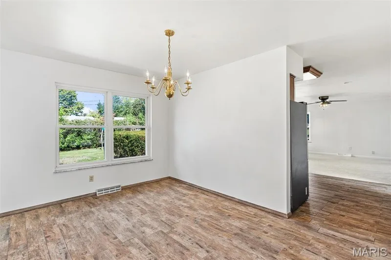 Separate dining room leads to kitchen — 109 Meadowlark Lane, St Charles, MO 63301