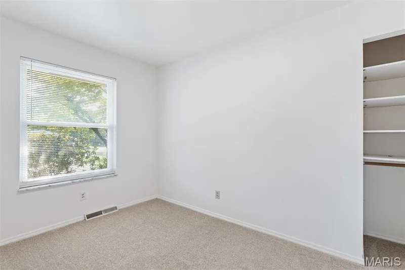 Bedroom #2 features organization system in closet — 109 Meadowlark Lane, St Charles, MO 63301