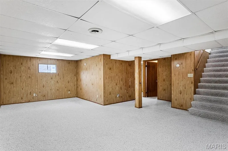 Lower level features rec room, sleeping area, full bathroom, and storage! — 109 Meadowlark Lane, St Charles, MO 63301