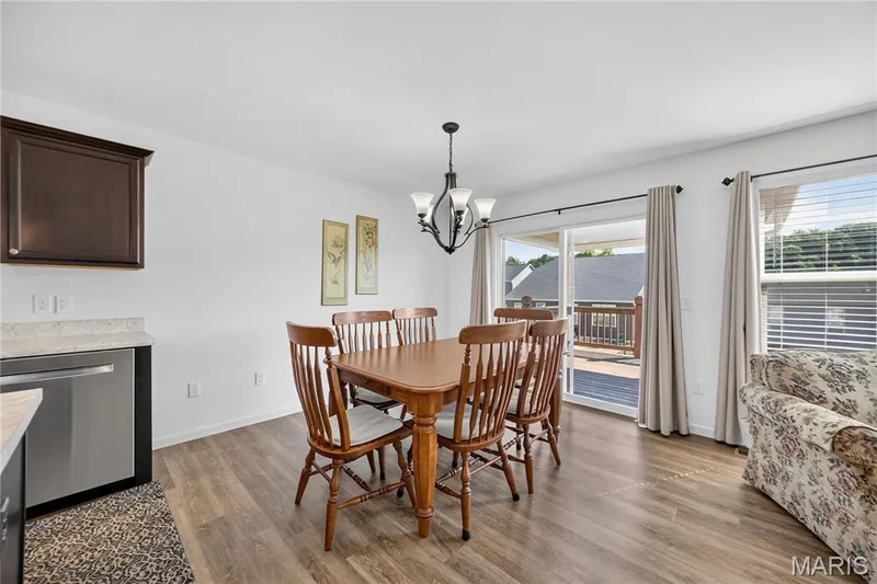 Breakfast room with door leading to covered deck — 619 Wilmer Meadow Drive, Wentzville, MO 63385