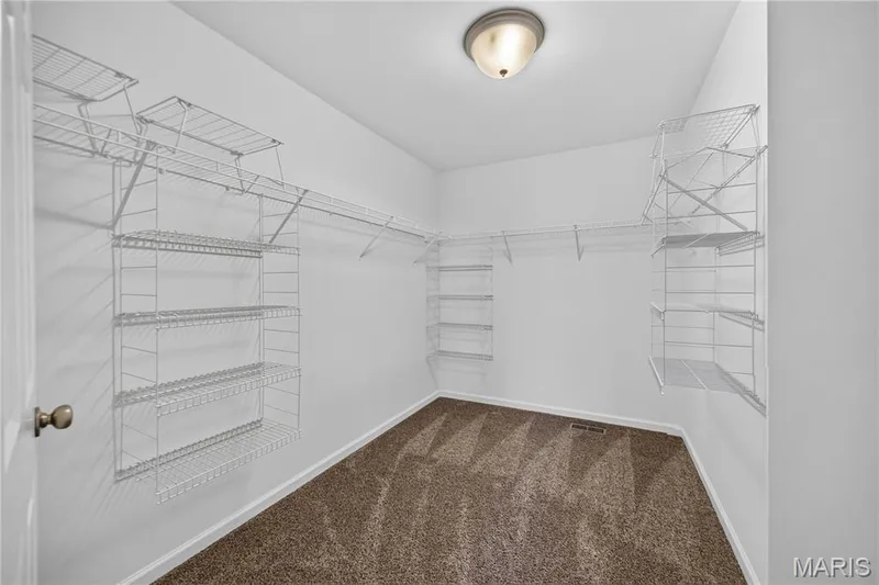 Primary bedroom walk in closet — 619 Wilmer Meadow Drive, Wentzville, MO 63385