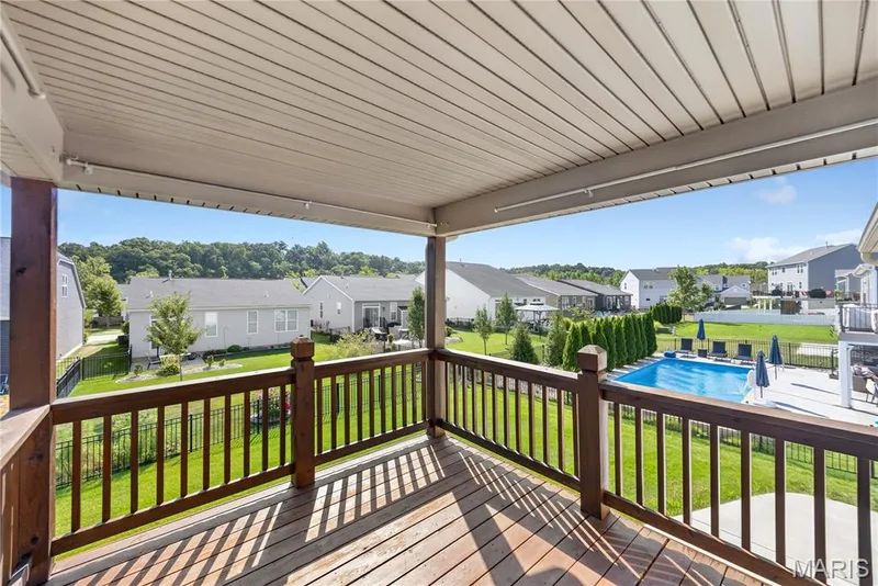 covered deck overlooking the fenced in level back yard — 619 Wilmer Meadow Drive, Wentzville, MO 63385