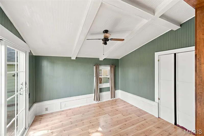 Light and bright sunroom with vaulted ceiling has newly installed sliding doors that lead to the backyard — 201 Perry Street, St Charles, MO 63301