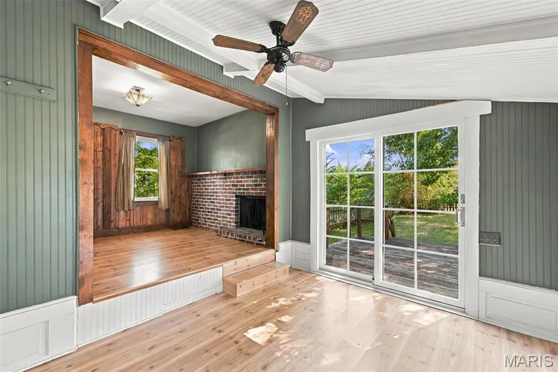 Light and bright sunroom with vaulted ceiling has newly installed sliding doors that lead to the backyard — 201 Perry Street, St Charles, MO 63301