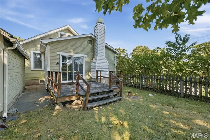 Fully fenced yard and deck off the back of the home gives space for entertaining this Fall! — 201 Perry Street, St Charles, MO 63301