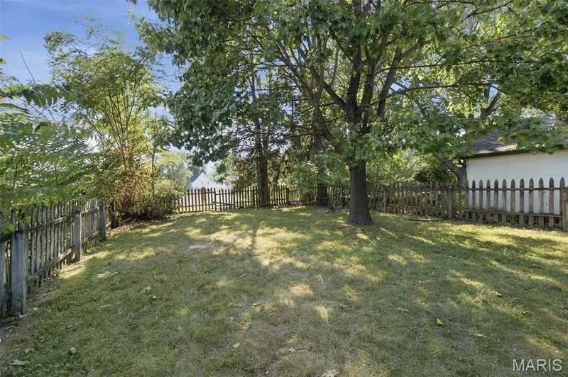 Fully fenced yard and deck off the back of the home gives space for entertaining this Fall! — 201 Perry Street, St Charles, MO 63301