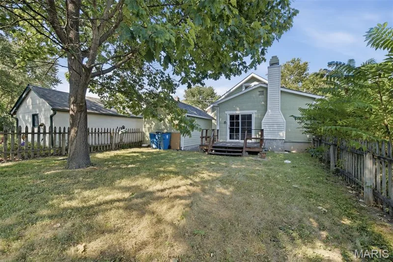 Fully fenced yard and deck off the back of the home gives space for entertaining this Fall! — 201 Perry Street, St Charles, MO 63301