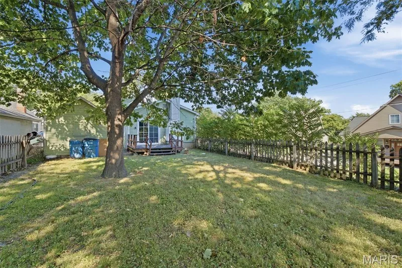 Fully fenced yard and deck off the back of the home gives space for entertaining this Fall! — 201 Perry Street, St Charles, MO 63301