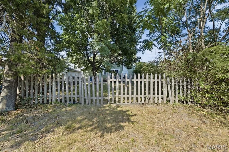 Fully fenced yard and deck off the back of the home gives space for entertaining this Fall! — 201 Perry Street, St Charles, MO 63301