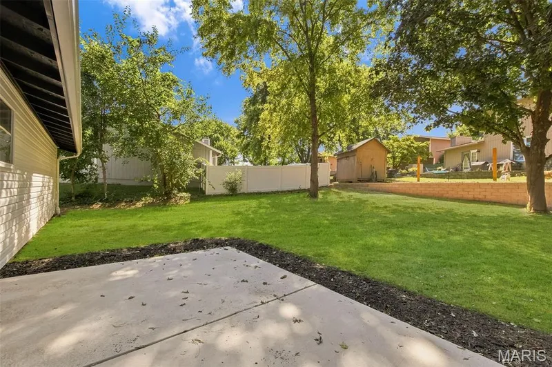 AI-enhanced image. Grass digitally restored to illustrate anticipated appearance following recent landscaping/retaining wall w — 18 Craigwood Drive, St Peters, MO 63376