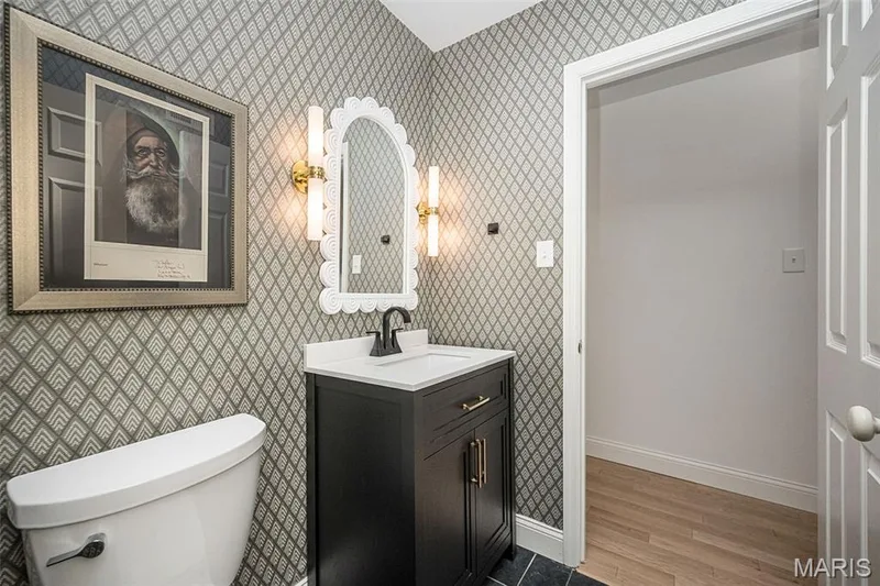 Main floor bathroom flows into the main floor bedroom and into the hallway — 440 Meramec Way, St Charles, MO 63303