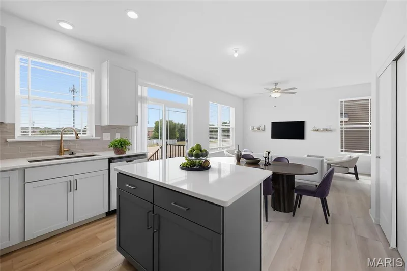 Virtually Staged Kitchen with Island and Seating Bar — 32 Wingtip Court, St Peters, MO 63376