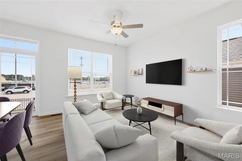 Virtually Staged Family Room with 9 Foot Ceilings and Luxury Vinyl Plank Flooring — 32 Wingtip Court, St Peters, MO 63376