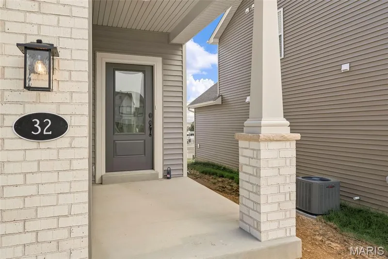 Welcoming Front Porch with Craftsman Style Porch Post with Brick Base — 32 Wingtip Court, St Peters, MO 63376