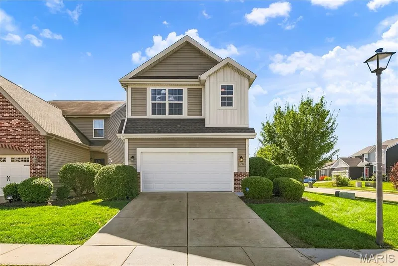 Two Story on a Corner Lot with Vertical and Horizontal Vinyl Siding, Brick Accent, Landscaping and Lawn Irrigation — 1700 Coupru Court, St Peters, MO 63376